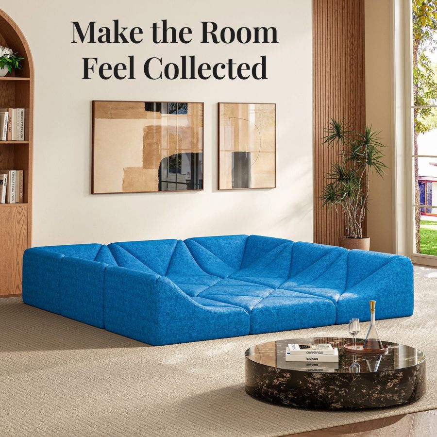 Blue Dune modular sofa square-pit layout styled beneath gallery art in a neutral living room