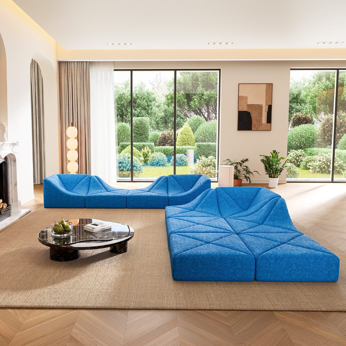 Blue Dune modular sofa split into two wave groupings in a bright room with garden views