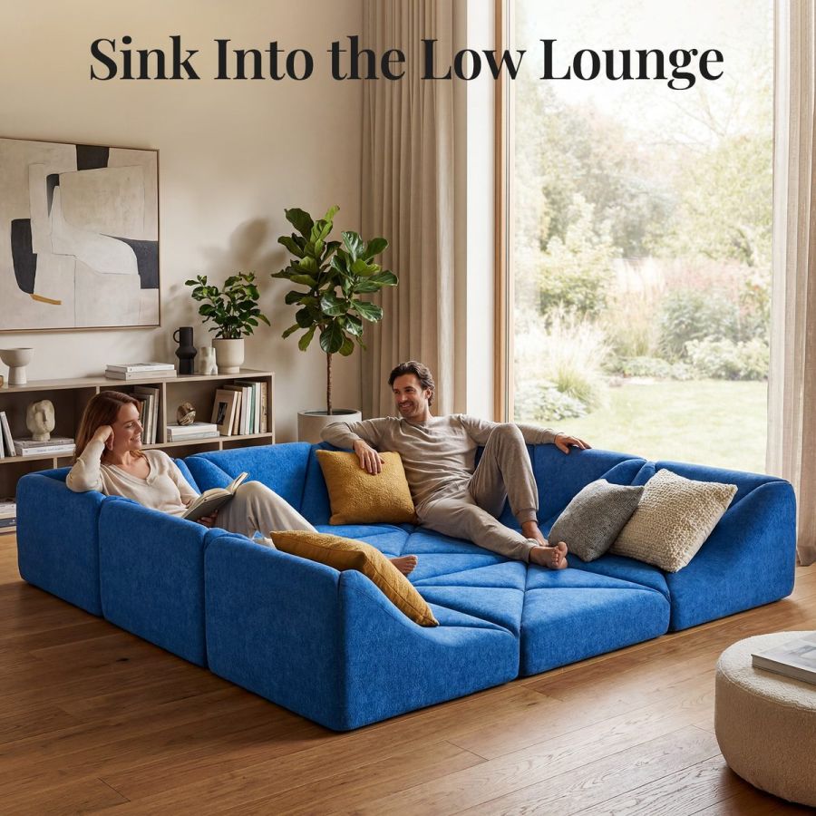 Blue Dune modular sofa square-pit layout with two people lounging beside a garden window
