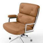 Close-up of the Light Brown Eames Executive Office Chair's button-tufted seat, back and padded armrests.