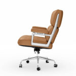 Side profile of the Light Brown Eames Executive Office Chair showing its padded seat, back and armrest.