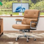 Light Brown Eames Executive Office Chair beside a desk overlooking a garden pond.