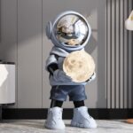 Life-Size Astronaut Holding Moon Statue