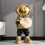 Life-Size Astronaut Holding Moon Statue