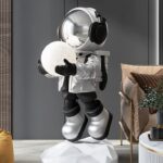 Life-Size Floating Astronaut Holding Moon Statue
