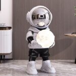Life-Size Astronaut Holding Moon Statue