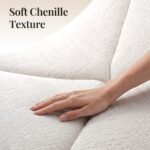 White Dune sofa close-up of chenille texture and seam detail, a hand touching the fabric